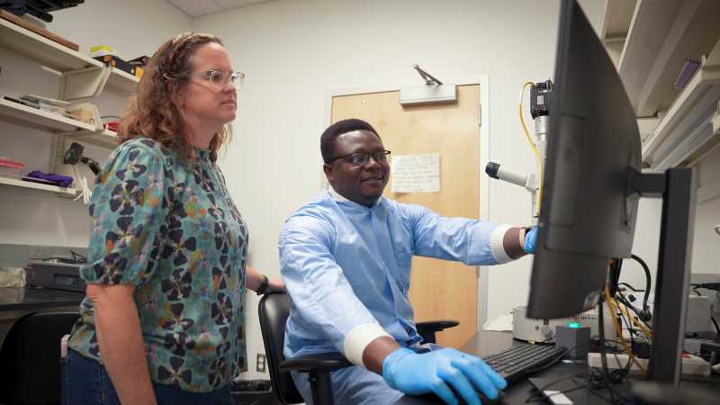 UWL Biology Professor Tisha King-Heiden, left, pictured with Eldith Adongo, a 2025 graduate of the biology master’s program. In addition to mentoring students in her lab, King-Heiden teaches courses focused on toxicology and environmental biology. Photo courtesy of Wisconsin Sea Grant.