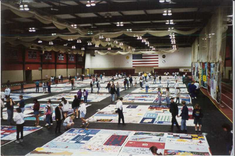 A portion of the AIDS Memorial Quilt was displayed in Mitchell Hall Fieldhouse April 27-30, 1995. More than 700 “volunteers of love” signed up to help coordinate the four-day display.