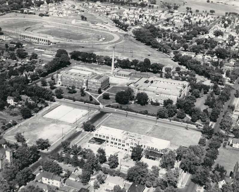  An aerial view looking east to the bluffs over the La Crosse State Teachers College with athletic field and fair grounds in the background ca. 1939. Photo courtesy UWL Murphy Library, Special Collections/ARC.