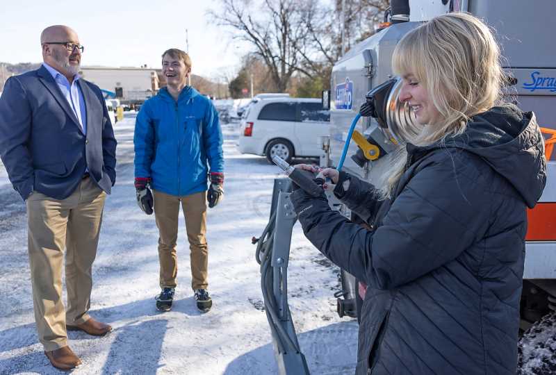 From left, Scott Brown, Andrew Ericson and Casey Christ with the new brine equipment.