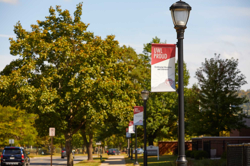 Beginning this fall, UWL will display banners on campus lamp posts to mark the 50th year of the College of Business Administration. UWL alumni and friends can purchase a banner and customize it with a short message.