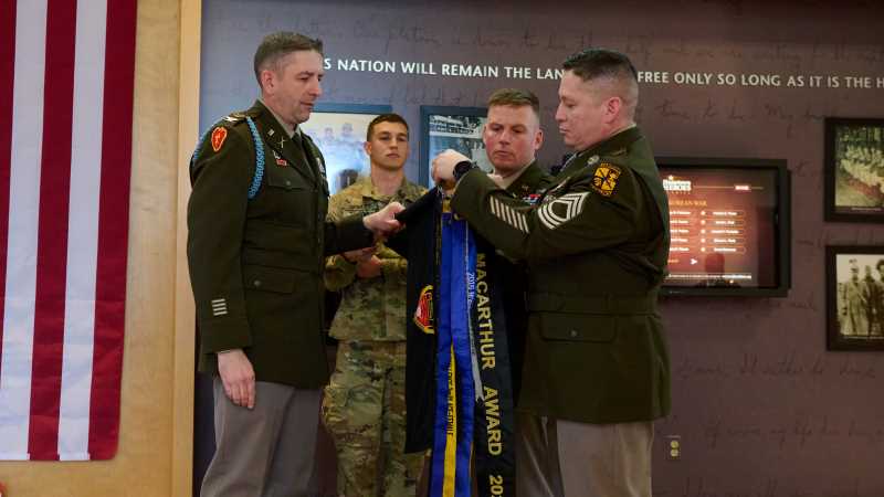 The UW-La Crosse Eagle Battalion receives a ribbon in recognition of the 2021 MacArthur Award. The award is given annually to the best ROTC battalion in the Midwest's Third Brigade, which comprises 42 military science programs in 10 states.