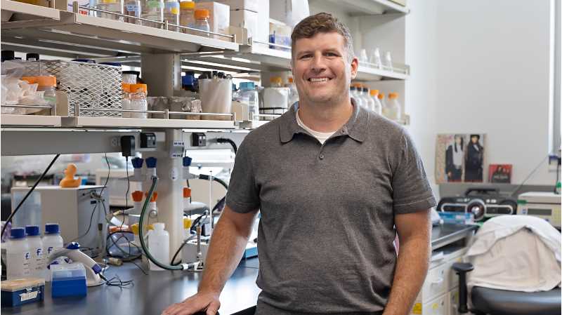 Dan Bretl, assistant professor of microbiology, is the inaugural recipient of the Eagle Research & Creativity Mentoring Excellence Award.