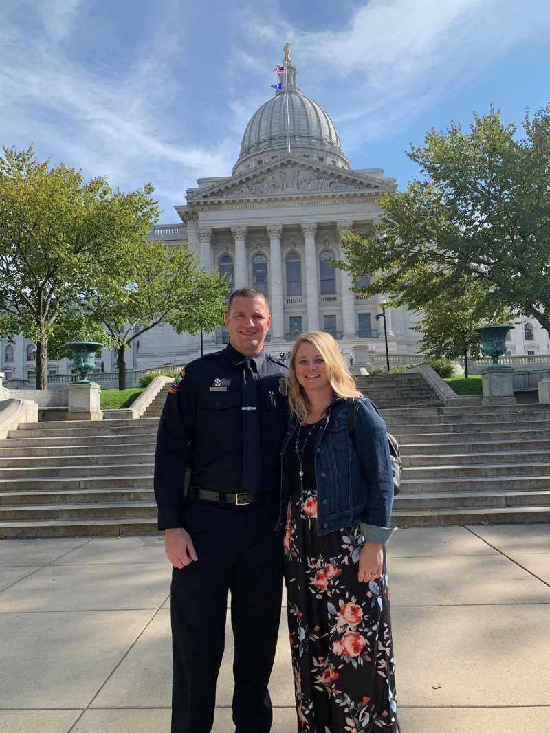 Dustin Darling, a former City of La Crosse police officer, was among the first to graduate from the new online Master of Science in Cybersecurity. Along with UWL, the other UW partner campuses in the program include Green Bay, Oshkosh, Parkside, Platteville, River Falls, Stevens Point and Superior. Darling was shot in the line of duty and after approximately eight years, he needed a career change to a field less stressful for his family. He is pictured here with his wife. 