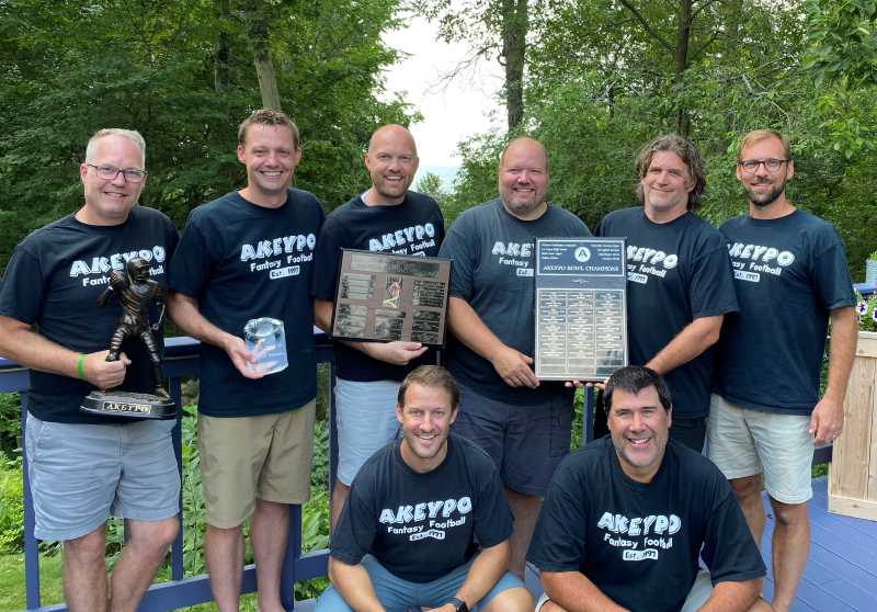 Eight UWL alumni remain close thanks to a fantasy football league they established 25 years ago. Front row left to right:  Michael O'Brien, Jason Patzer. Back row left to right:  Troy Richter (director of Parking Services at UWL), David Fehring, Matthew Pevan, Patrick Heise (assistant director of Residence Life at UWL), Wes Moran, Eric Jackelen.