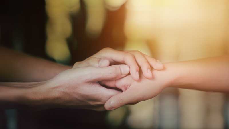 Even a simple gesture like holding a hand can offer comfort to someone nearing the end of life.