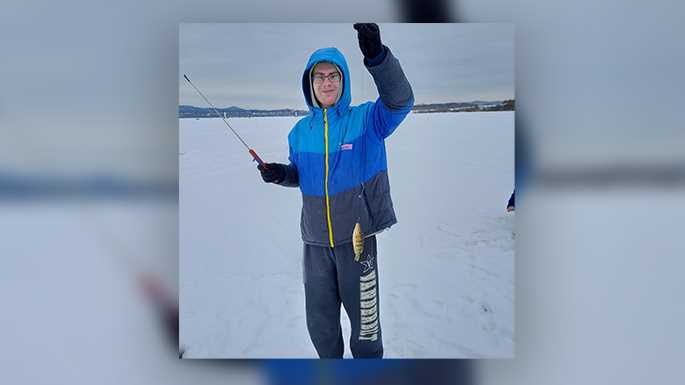 Member Jacob Dunnum proudly shows the first catch of the day for the Ice-Fish-A-Thon 2021 on Lake Onalaska. Eight UW-La Crosse Sigma Tau Gamma members raised $3,610 for Special Olympics.