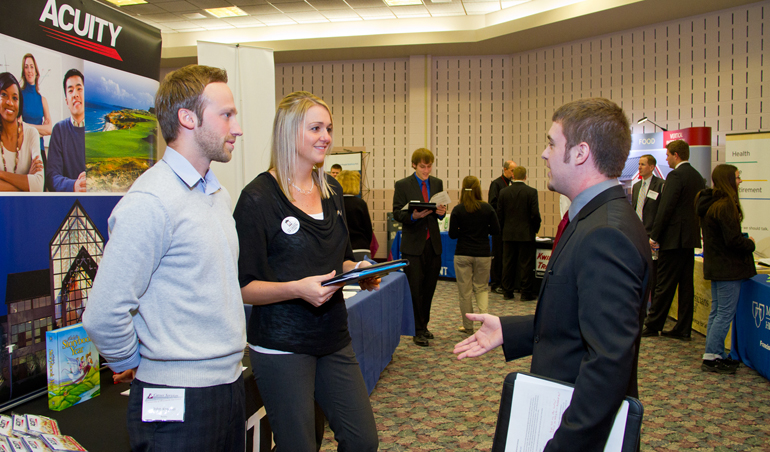 Career Expo 2012 Student talking to reps at Acuity.