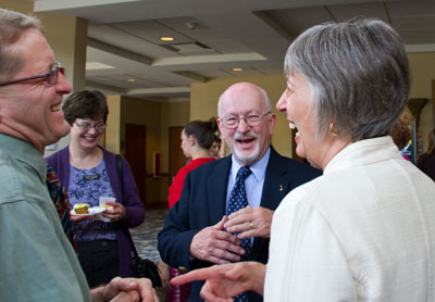 Anita Evans laughing in group.