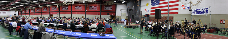 Veterans Breakfast November 11, 2012 Wide shot of event with band and people at tables.