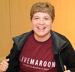 Woman with LIVEMAROON T-shirt.