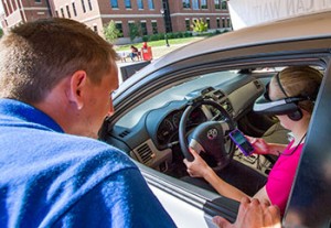 Student texting in car.