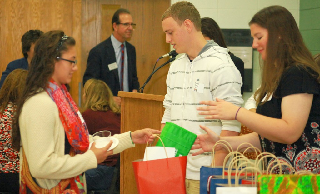 Students handing out door prizes. 