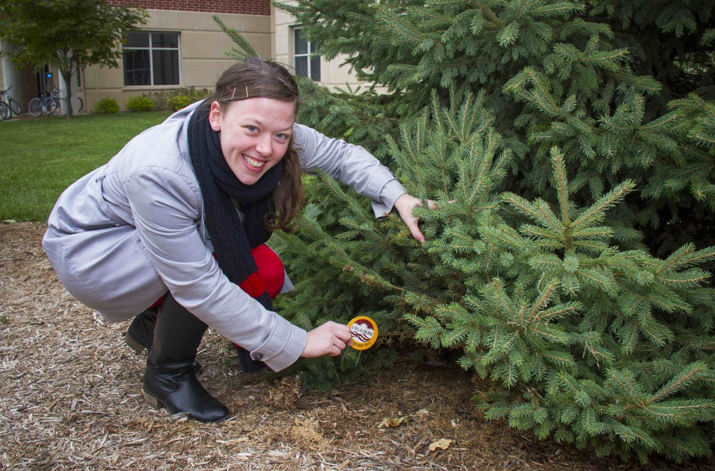 Nicole Bottelson, a senior from Baraboo, found the Eagle Eye Medallion under a pine tree near Reuter Hall after the fourth clue.