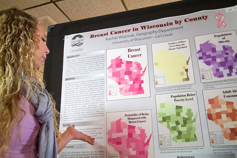 GIS student with poster.