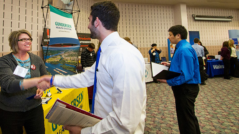 Student talking to rep. 