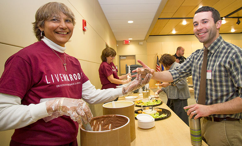 Claudette Bode serving ice cream at the LIVE MAROON event. 