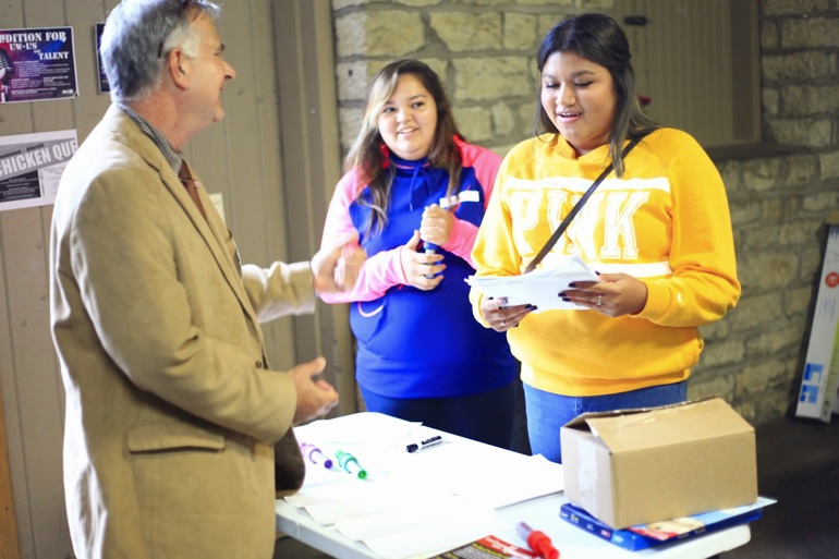 Larry greeting students.
