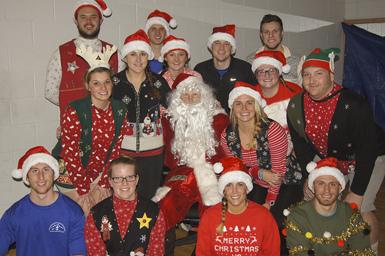 Group photo of students with Santa. 