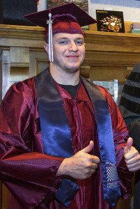 Michael Bahr in gown with thumbs up. 