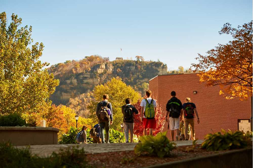 UWL students walk to Cartwright Center with Granddad bluff in the background.
Read more →
