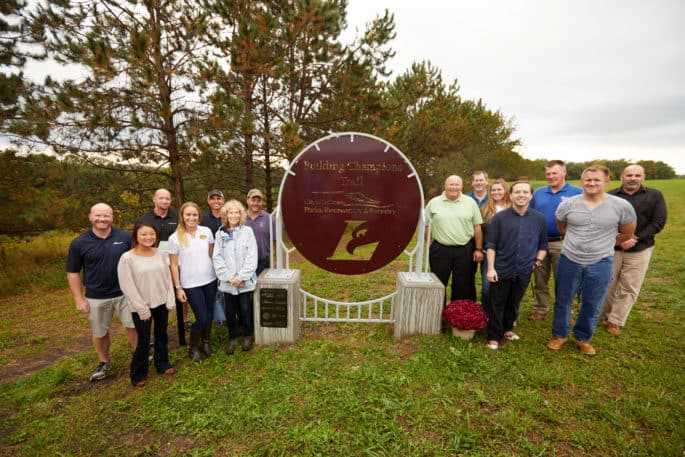 Community partners that helped make the new “Building Champions Trail” possible pose next to the brand new sign.
Read more →
