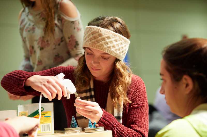 Marissa Duggan, a freshman biology major from Waukesha, uses a glue gun to prepare a tiny tree for a tiny snow globe during “holiday crafts on a budget” before winter break. The event was sponsored by “It Make$ Cents.”
Read more →
