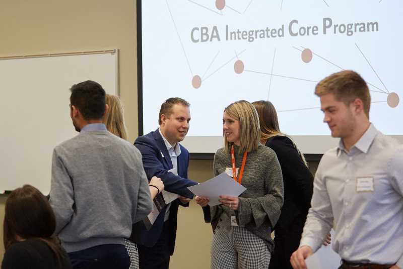 Jeff Olson, center, senior finance director for Reinhart Foodservice, congratulates students after announcing the $500 scholarship for 10 students in the Integrated Core Program.
Read more →