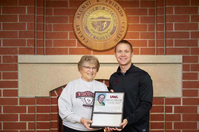 Kay Taylor, Rollo’s wife presented UWL Men’s Basketball Coach Kent Dernbach with a plaque that will list freshman award recipients. 
Read more →
