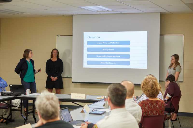 Sociology and Criminal Justice Assistant Professor Lisa Kruse, far left, and mathematics students Megan Dean and Cassandra Quinn, right, present their study findings to La Crosse County criminal justice practitioners. The research evaluated three questions asked of offenders during their initial booking, called the Arrest Proxy.
Read more →