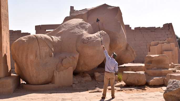 David Anderson photographing for 3D a colossal statute of Ramses II at the Ramesseum, the mortuary temple of Ramses II on the West Bank in Luxor, Egypt.  Using a process called photogrammetry, Anderson takes many photos of artifacts from multiple angles during his travels to museums and archaeological sites around the world. He then transforms them into moveable, 3D models on his computer screen. Photographer: Ayman Damarany; American Research Center in Egypt.
Read more →
