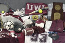 Photo of clothing and props from various sports. 