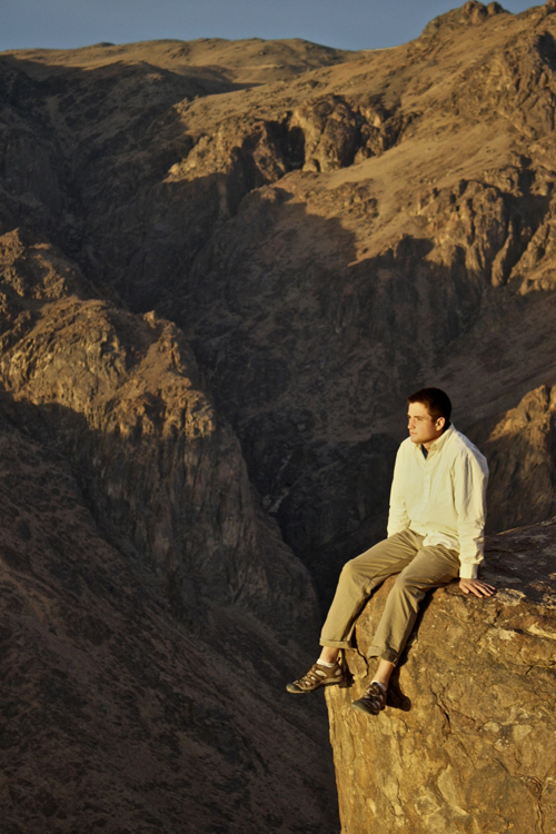 UW-L student Atticus Jaramillo sits on a rock in Egypt. Photo courtesy of Logan Shea.