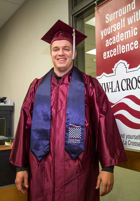 image of Michael Bahr wearing graduation robe and stole.