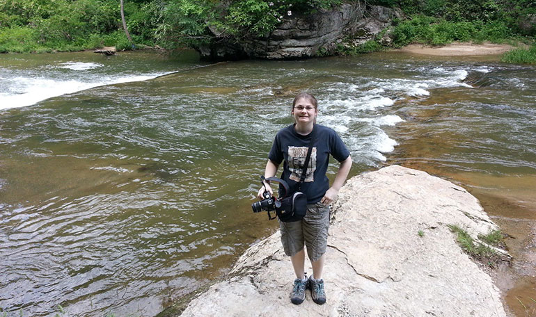 Beal on rock near water. 