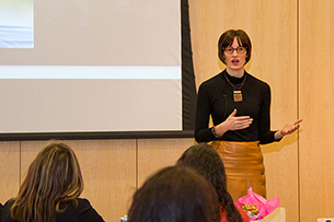 Image of Ariel Beaujot speaking in front of a group.