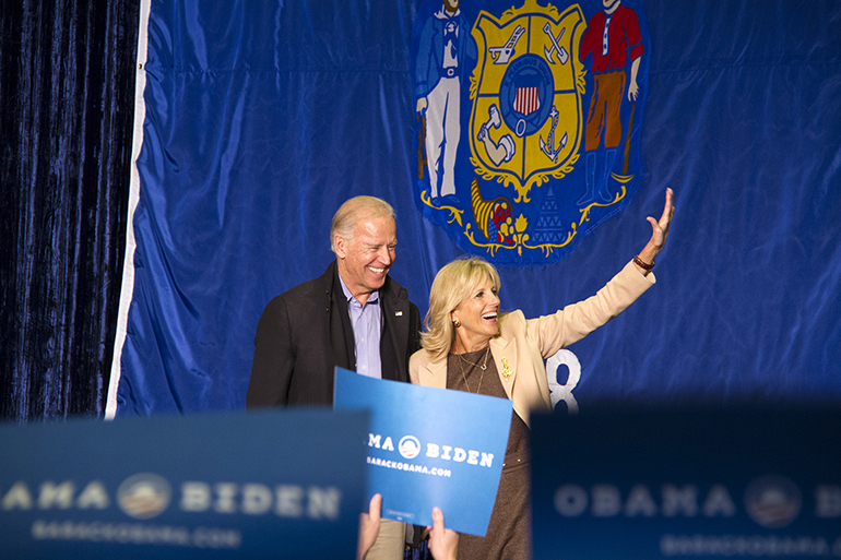 BidenW Joe and Jill Biden at podium.