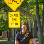 James Longhurst with share the road sign. 