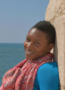 Image of Brittney Long leaning against a rock. 