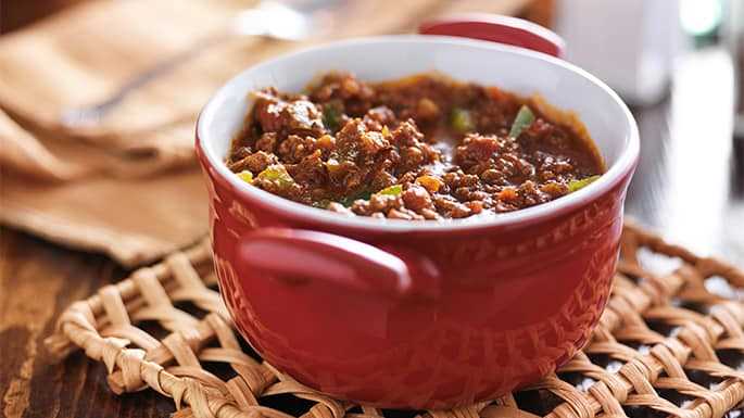 red dish cooling with meaty beef chili and bell peppers shot with selective focus
Read more →