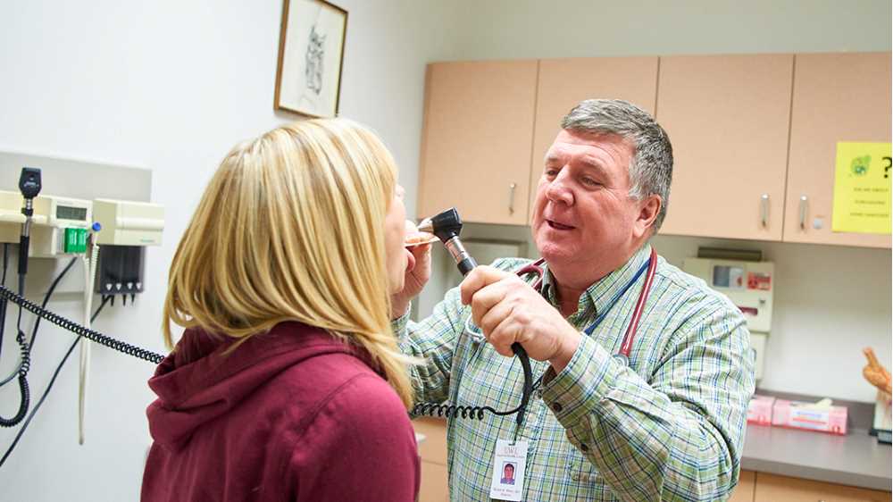Dr. Brian Allen, director of UWL’s Student Health Center, gives a checkup to a student at the Student Health Center. 
Read more →
