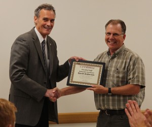 Chancellor Joe Gow presents David Anderson with the first Classified Staff Excellence Award