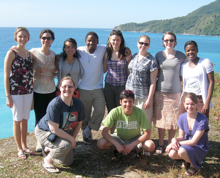 Group photo in front of ocean. 