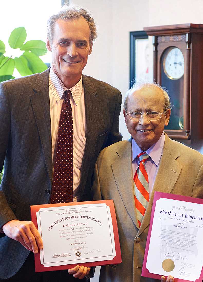 Jow Gow presents Rafique Ahmed, retired geography professor, certificates from UWL and Wisconsin, honoring him for 31 years of dedicated services to higher education.
Read more →
