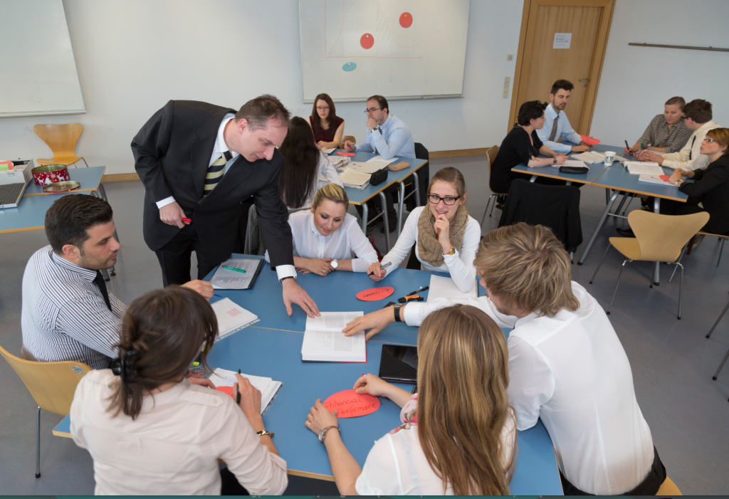 Swen Schneider, dean of Frankfurt University of Applied Science, pictured working with students in an e-commerce master’s-level class at Frankfurt University of Applied Science. Schneider says increasingly business classes at the school are being taught in English.