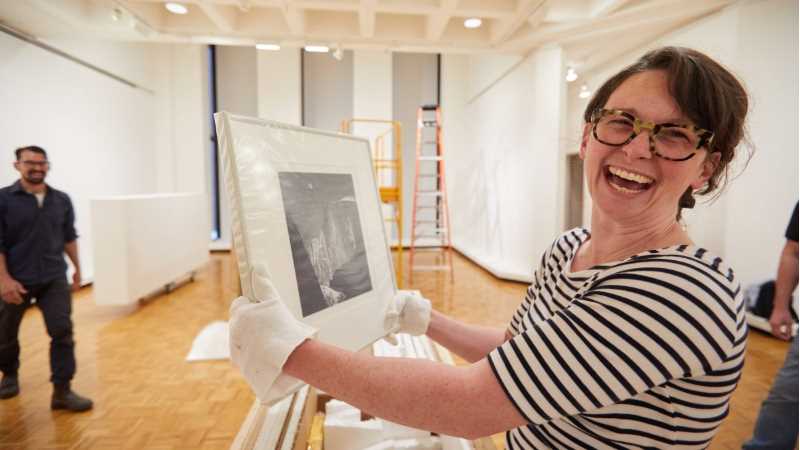 Kathleen Hawkes, assistant professor of art, smiles as she sees the original print “Moon and Half Dome, Yosemite National Park” by Photographer Ansel Adams.
Read more →
