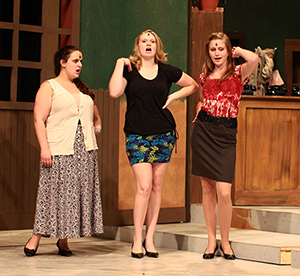 Three students talking on set of "Little Shop of Horrors."