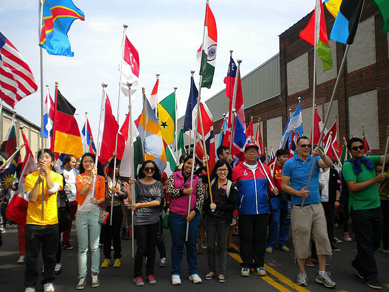 Political Science student Pizwak Imitiaz, pictured front row, third from left, marching in the La Crosse Oktoberfest Parade in (year).
