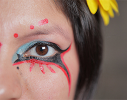 Woman with eyes painted dramatically.