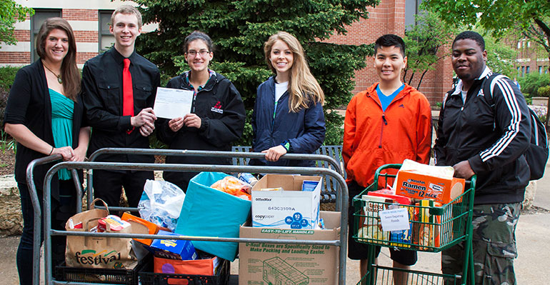 Group photo of choir with food.